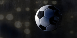 Picture of a traditional football in front of a dark background