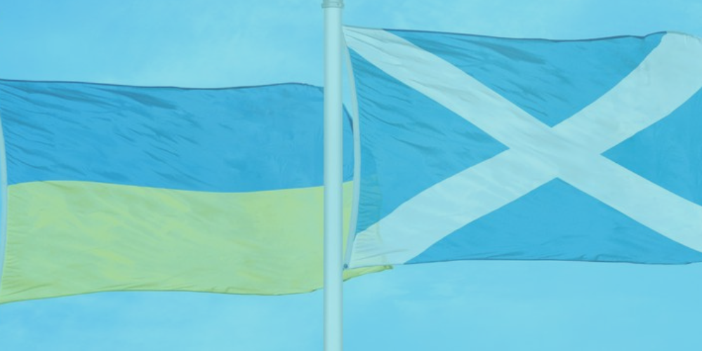 picture of a Ukrainian flag and a Scottish flag side by side